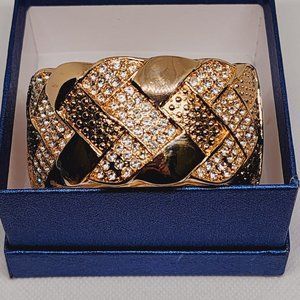 Austrian Crystal hinged bangle bracelet in goldtone over brass